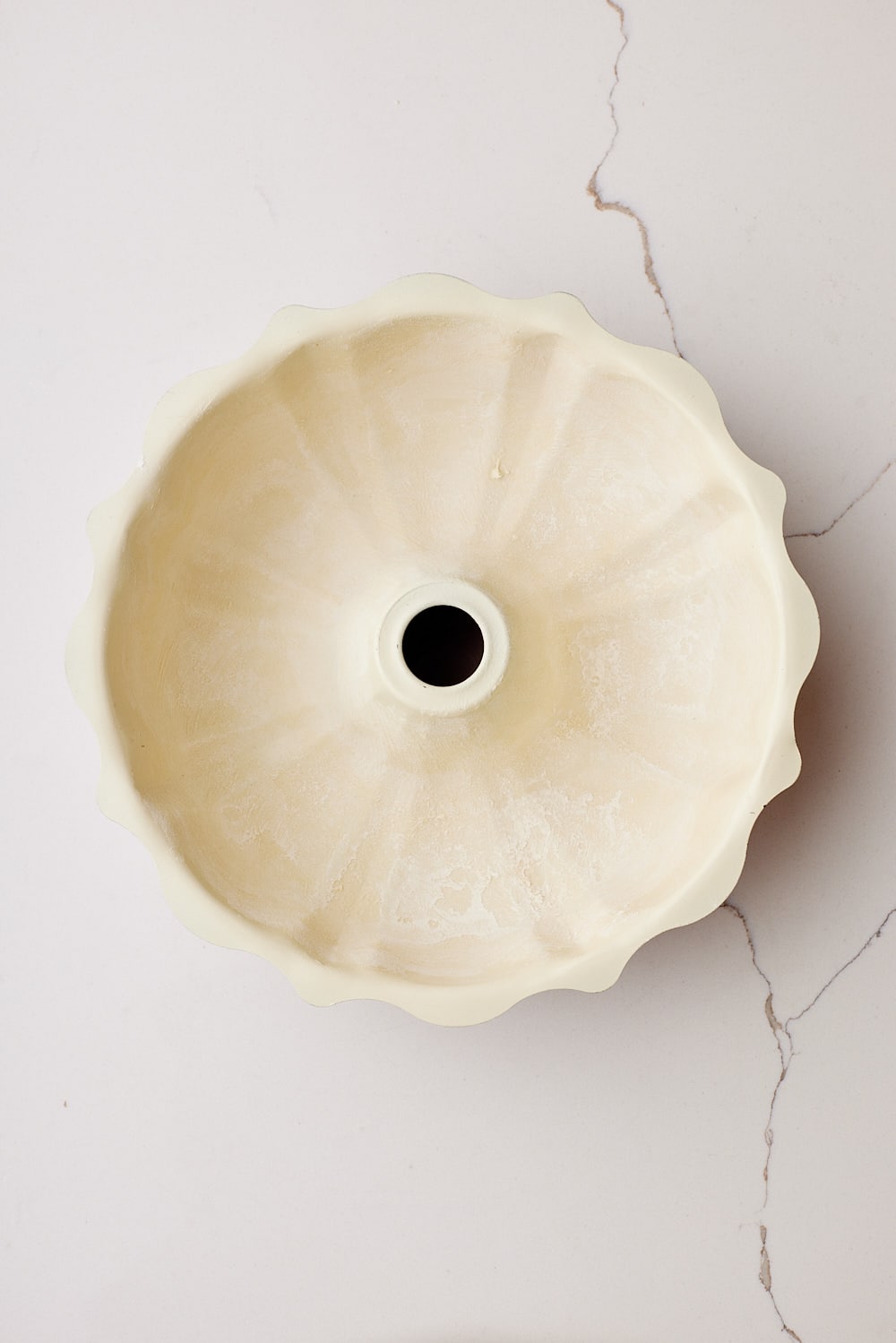 A generously-buttered and floured bundt cake pan for Hot Milk Cake. 