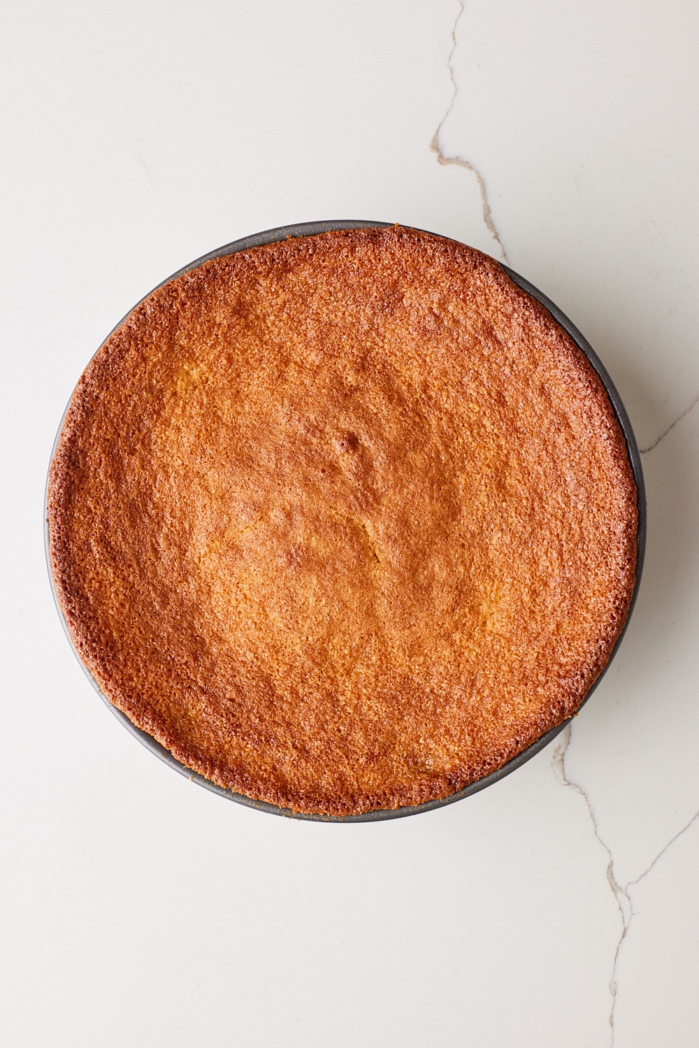 Peach Upside Down Cake baked golden brown in a pan. 