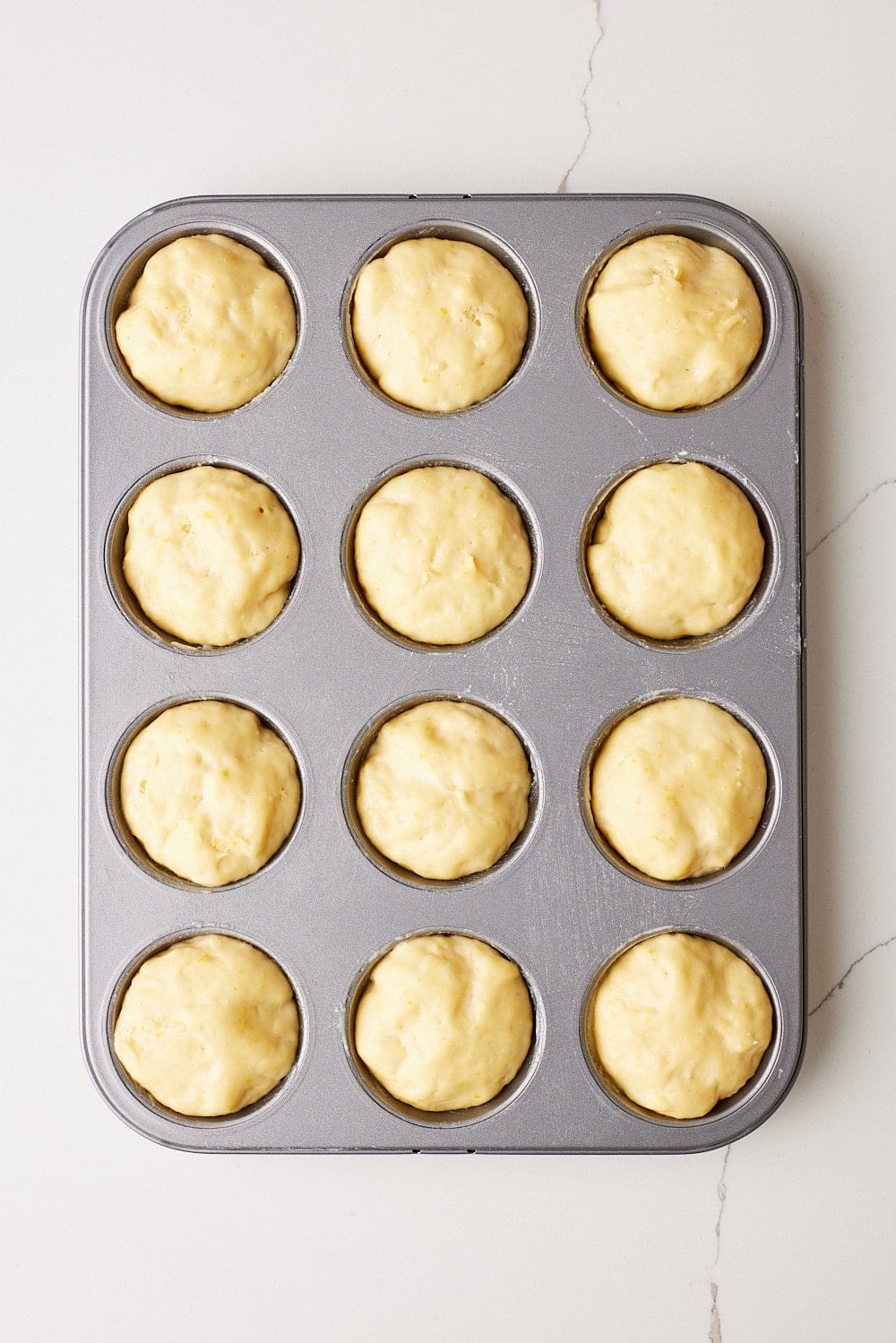 Let Sally Lunn Buns rise until puffy and nearly doubled in the pan. 