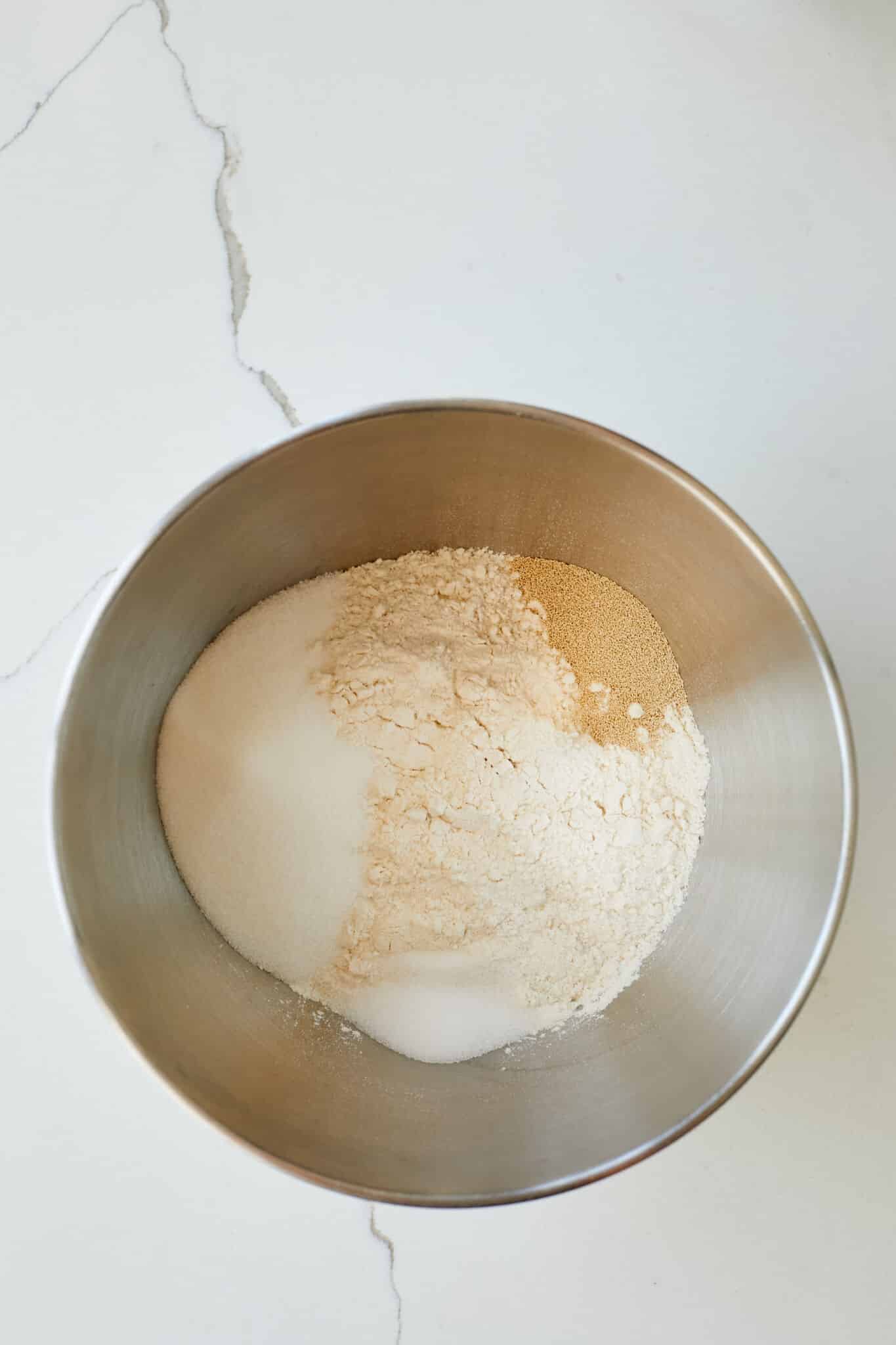 Mis dry ingredients for Sally Lunn Buns in a bowl. 