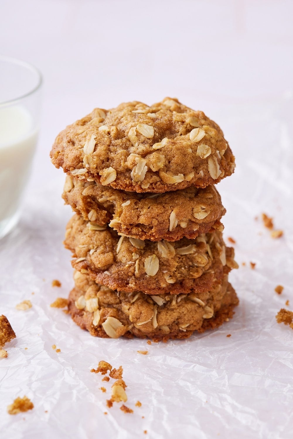 A stack of puffed golden browned butter oatmeal cookies. 